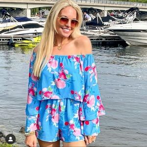 Pink lily floral romper size small worn once for pictures sold out online!